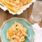 top view of lobster mac and cheese on blue plate with fork