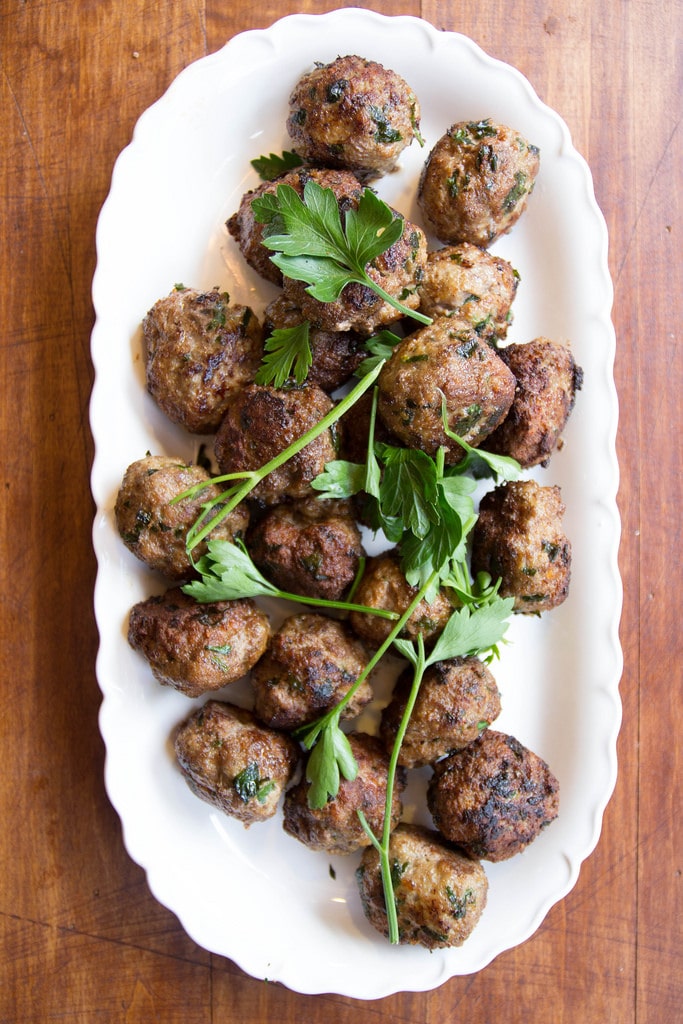 Italian meatballs make an easy dinner or can be made in bulk for an easy party dish with rolls