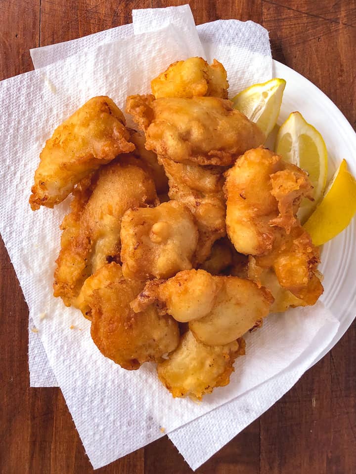 plate of fish fry with lemon wedges ready to eat