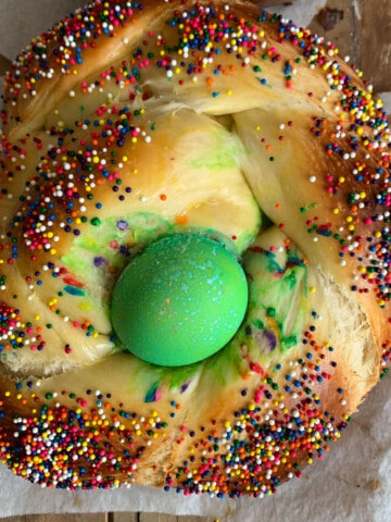 top view of italian Easter bread with sprinkles and green egg