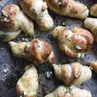 Use pizza dough to make these garlic knots that are loaded with garlic,