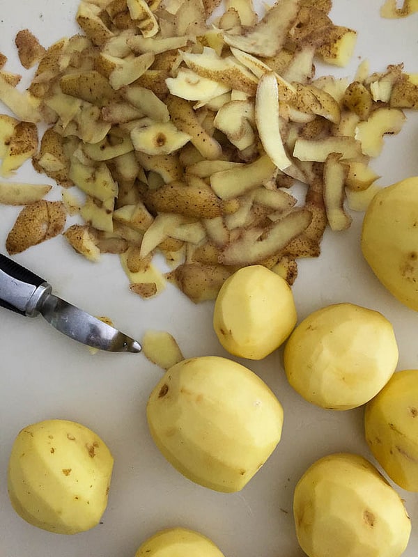 peeled potatoes and their peelings