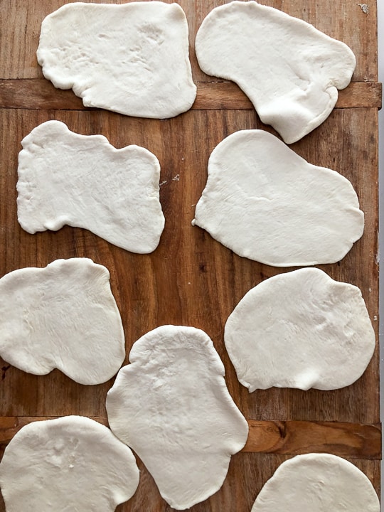 flatted dough balls ready to be shaped