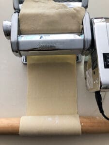 Staging dough on rolling pin after pasta machine.