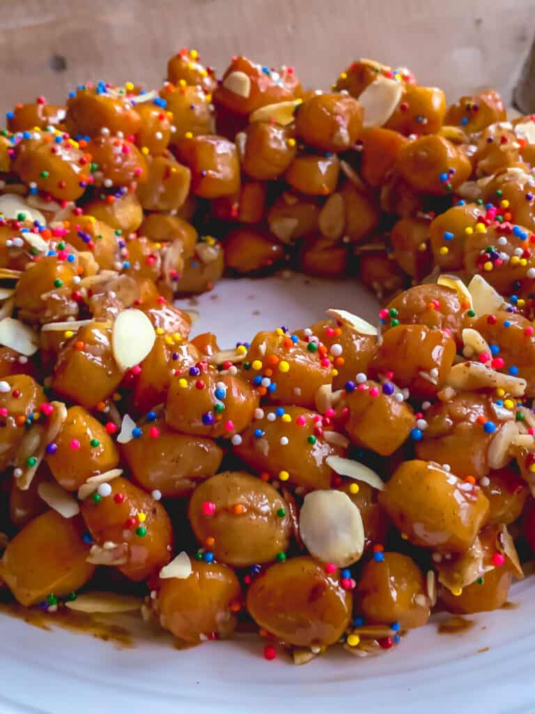 ¾ view of decorated struffoli with colored sprinkes
