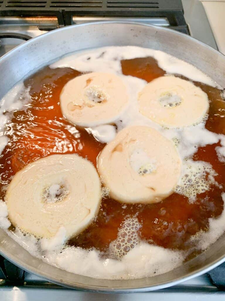 bagels in pan with kettle water boiling 