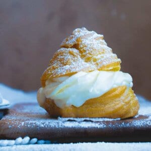 side view of italian cream puff with ricotta filling