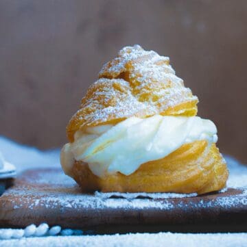 side view of italian cream puff with ricotta filling