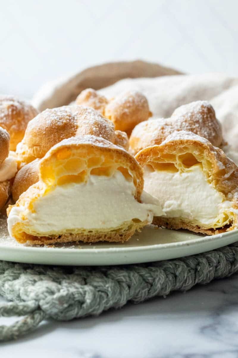 Cream-filled Italian cream puffs dusted with powdered sugar.