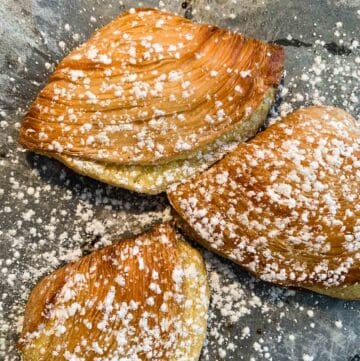 sfogliatelle with powdered sugar