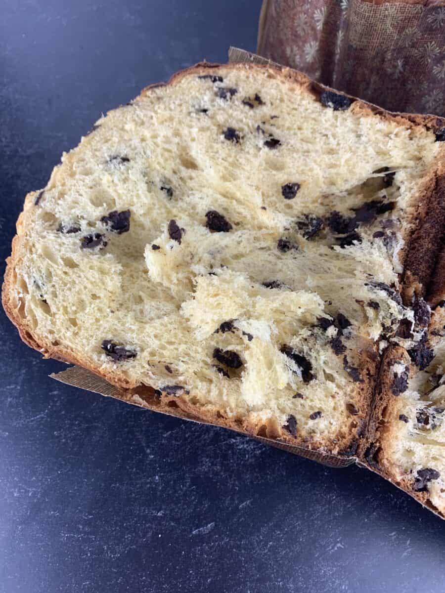 half a panettone laying in black background