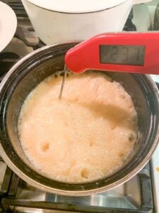 fudge cooking with digital thermometer in pot