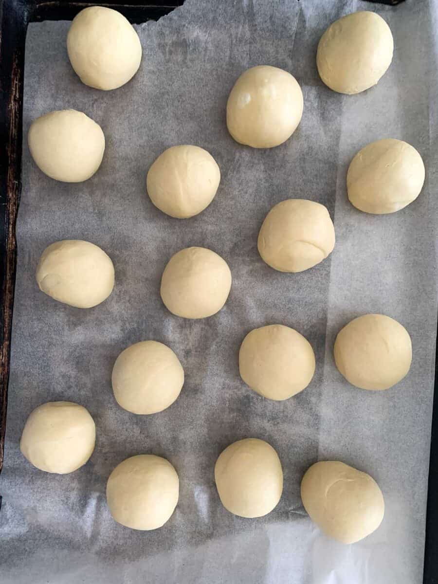 balls of kolache dough on parchment paper