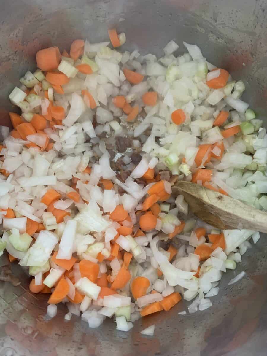 close up view of mirepoix saute for minestrone