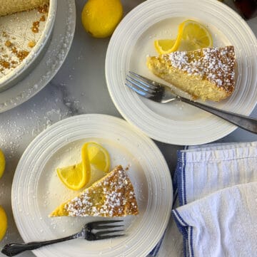 two plates with a slice of rice pie and a lemon twist on white background