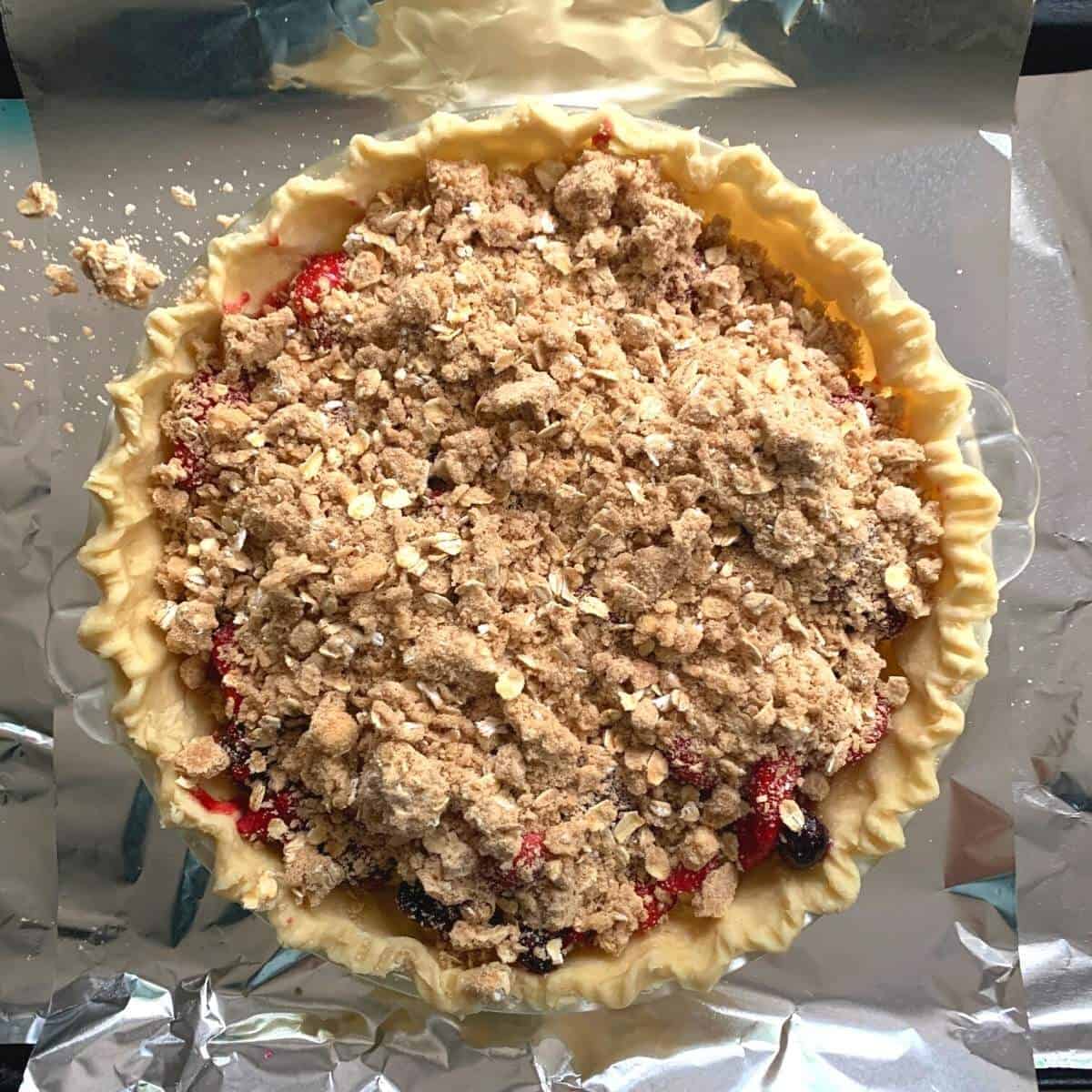 mixed berry pie ready to be baked