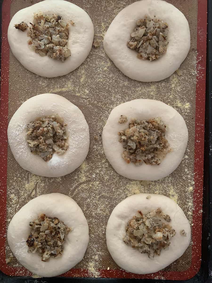 risen bialys dough filled with poppyseed onion filling