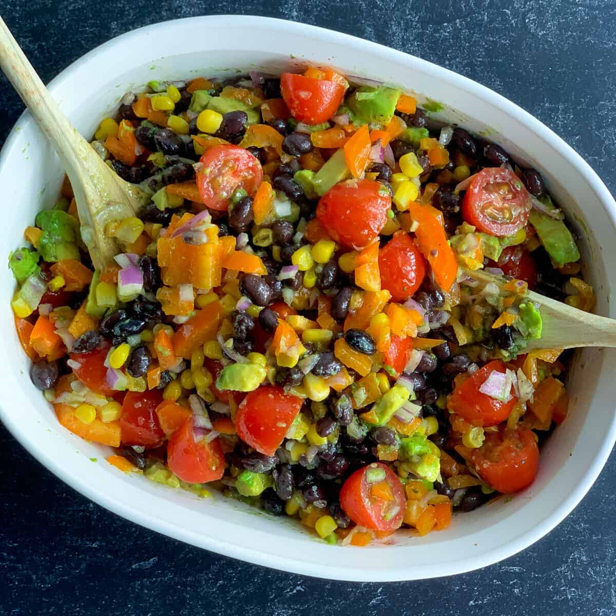 top view of black bean and corn salad in white dish
