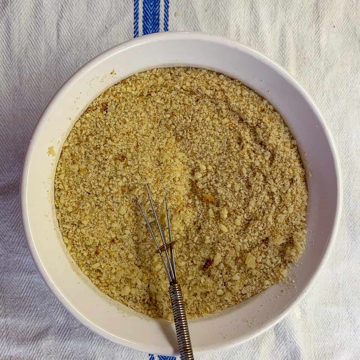 small bowl of breadcrumbs on white cloth