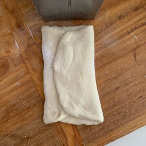 folding up sides of bread dough the same width as bread pan