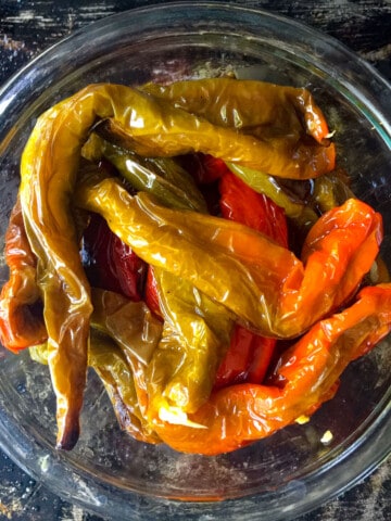 top view of roasted Italian long hots in glass bowl