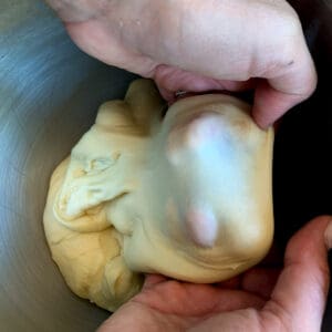 view of how to test and pull a windowpane in bread dough