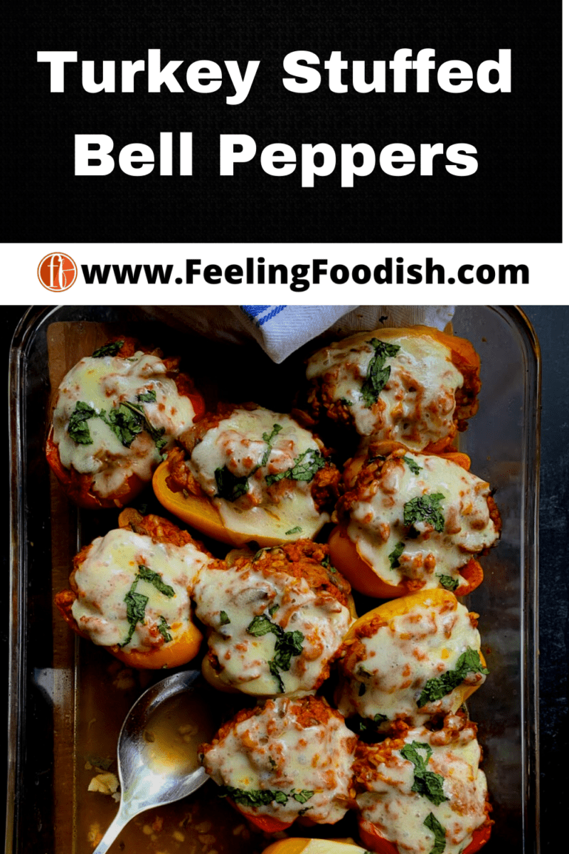 top view of baked stuffed bell peppers in large glass casserole with serving spoon