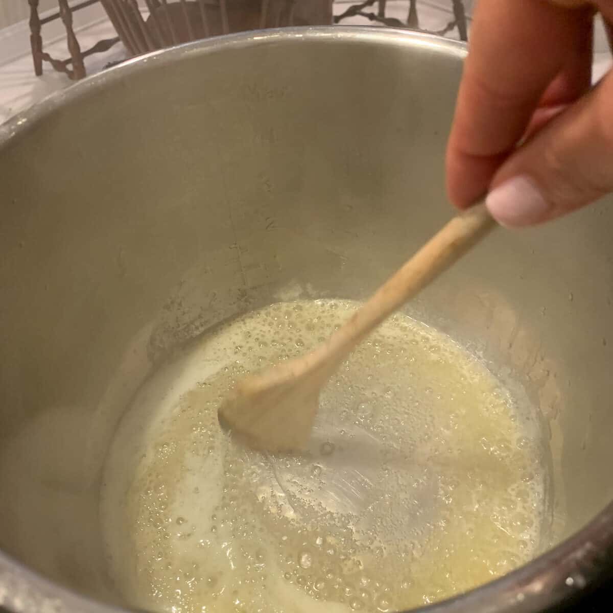 stirring melted butter and olive oil in pot 