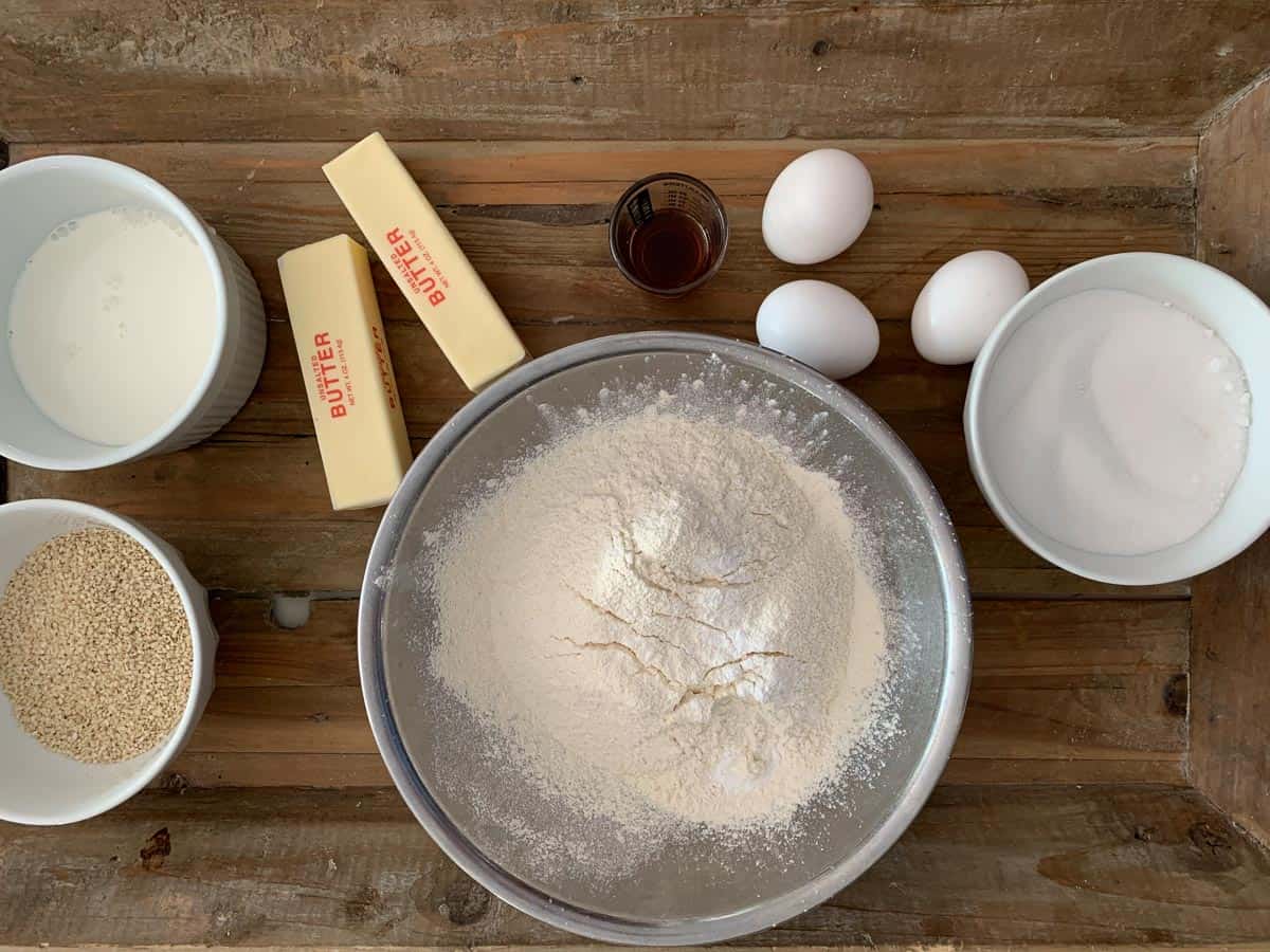 ingredients for Italian sesame seed cookies on wooden tray