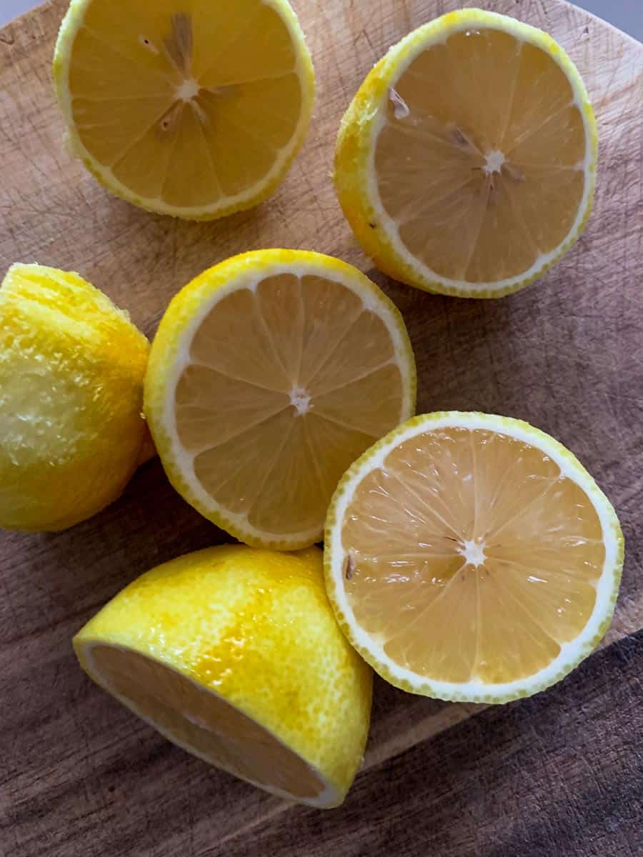 lemons halves on wooden board