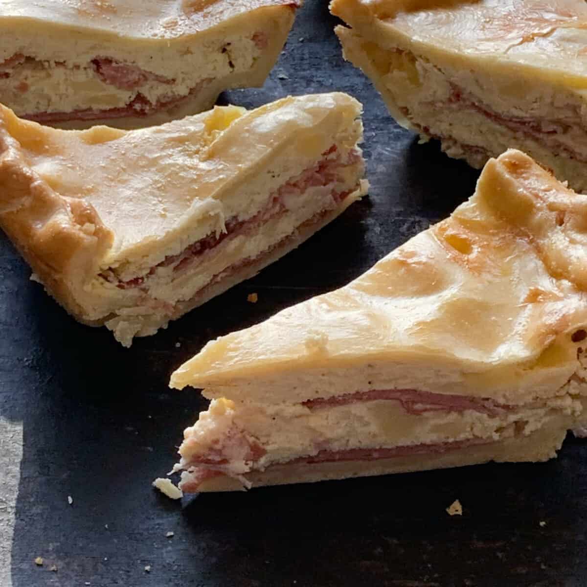 slices of Italian easter pie on black tray