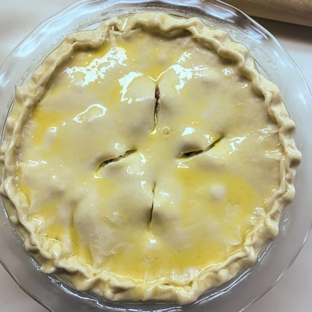 unbaked pie with vent slits