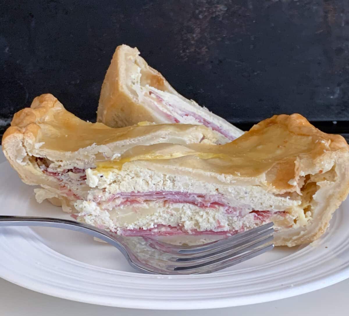 side view of easter pie slice on white plate