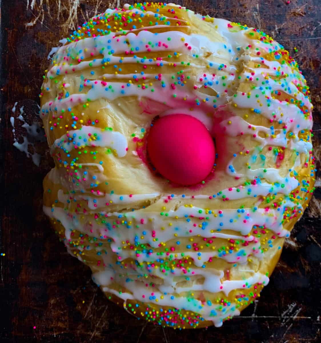 overhead view of easter bread with pink egg