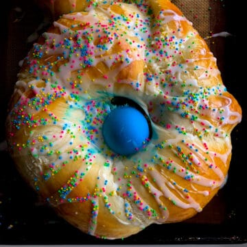 Overhead view of easter bread with blue egg