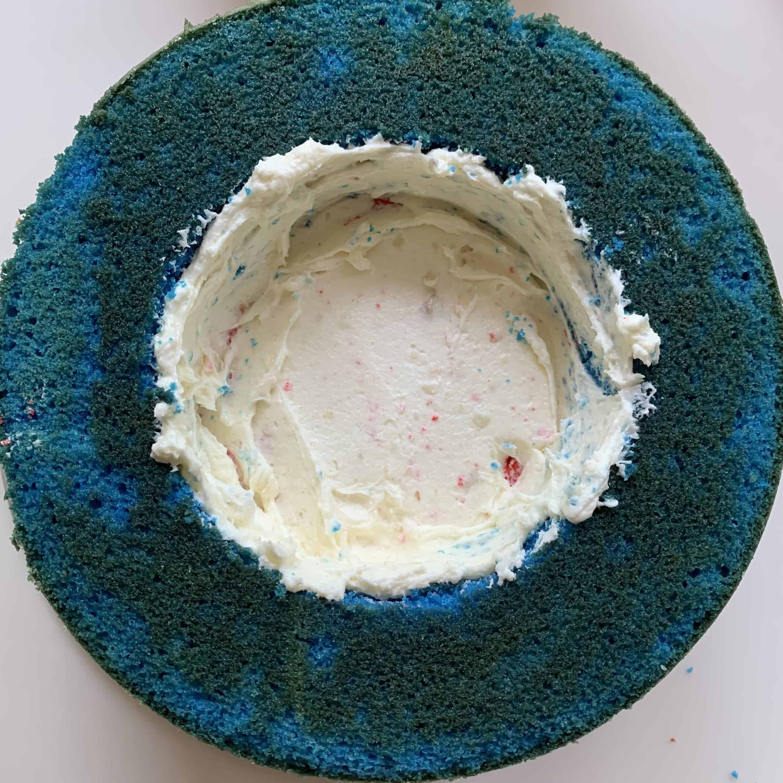 Frosting inside of blue cake ring