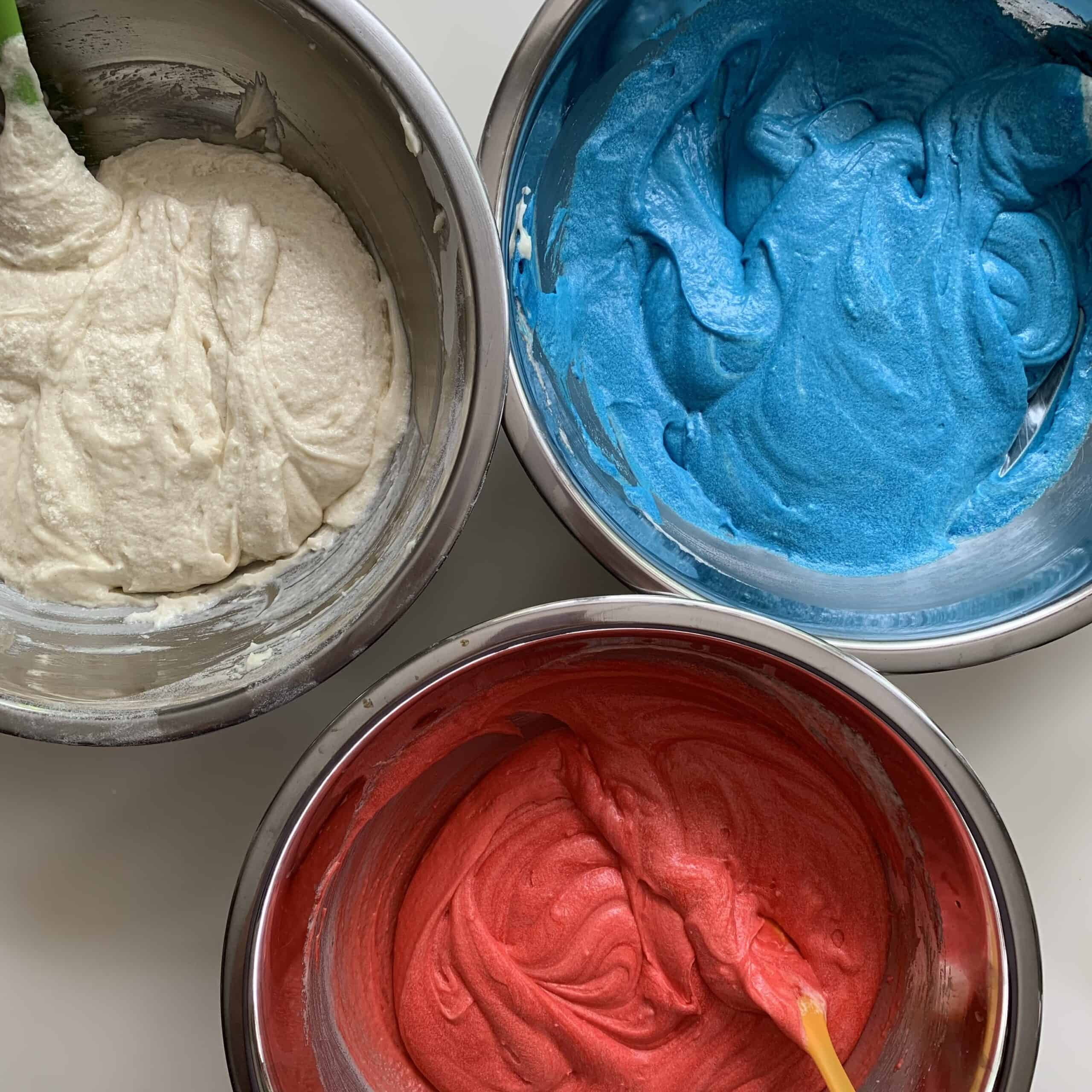 three bowls of cake batter red white and blue