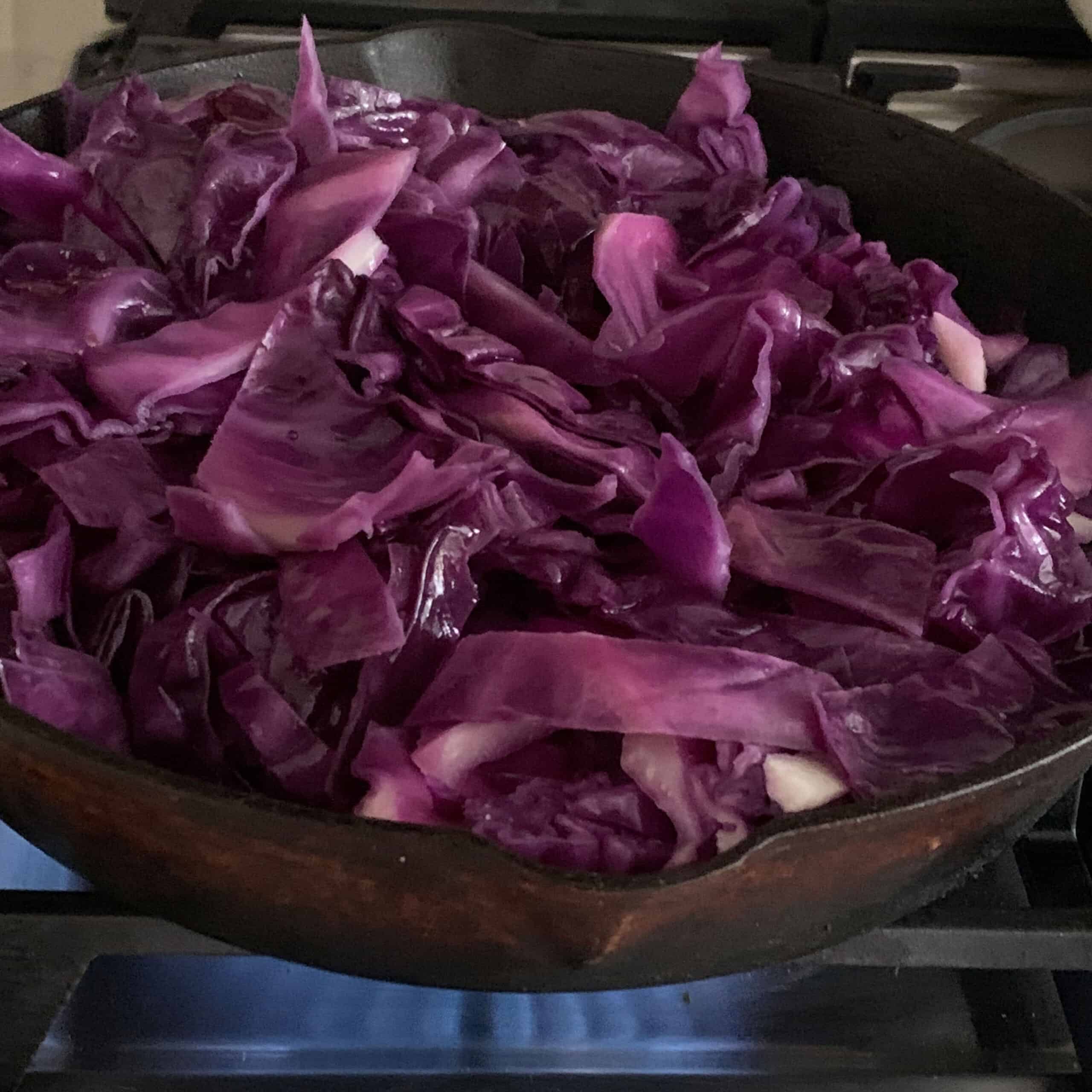 sliced red cabbage in pan on stove
