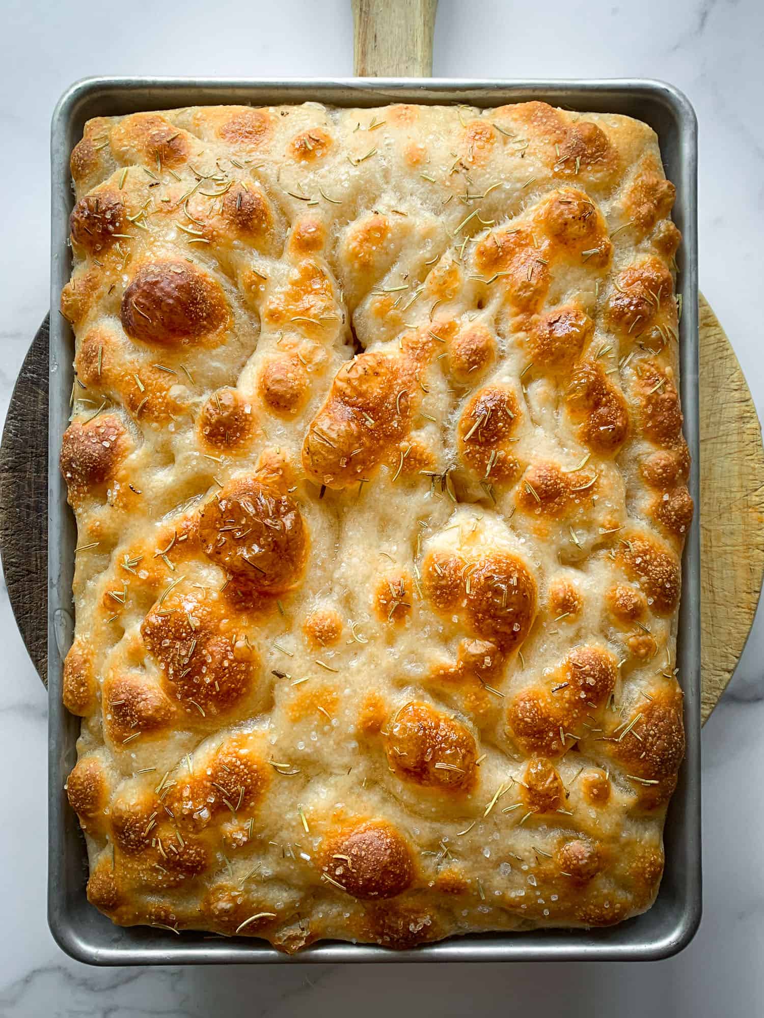top view of baked sourdough focaccia on tray 