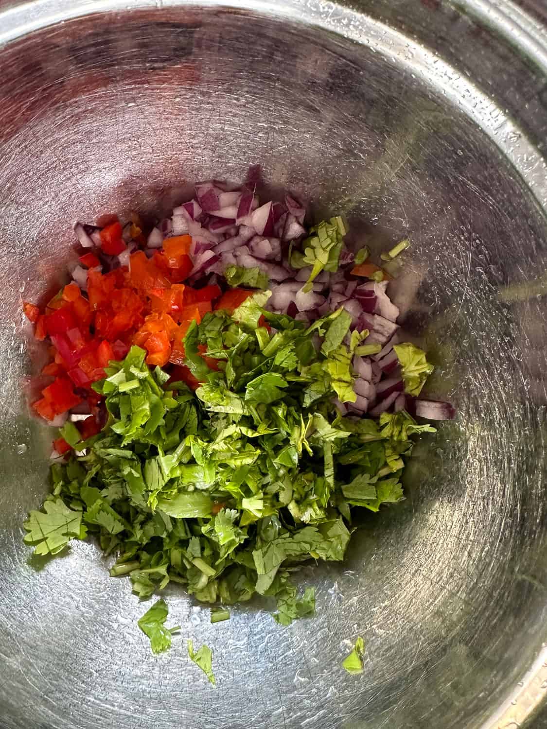 Aromatics for guacamole in a small bowl