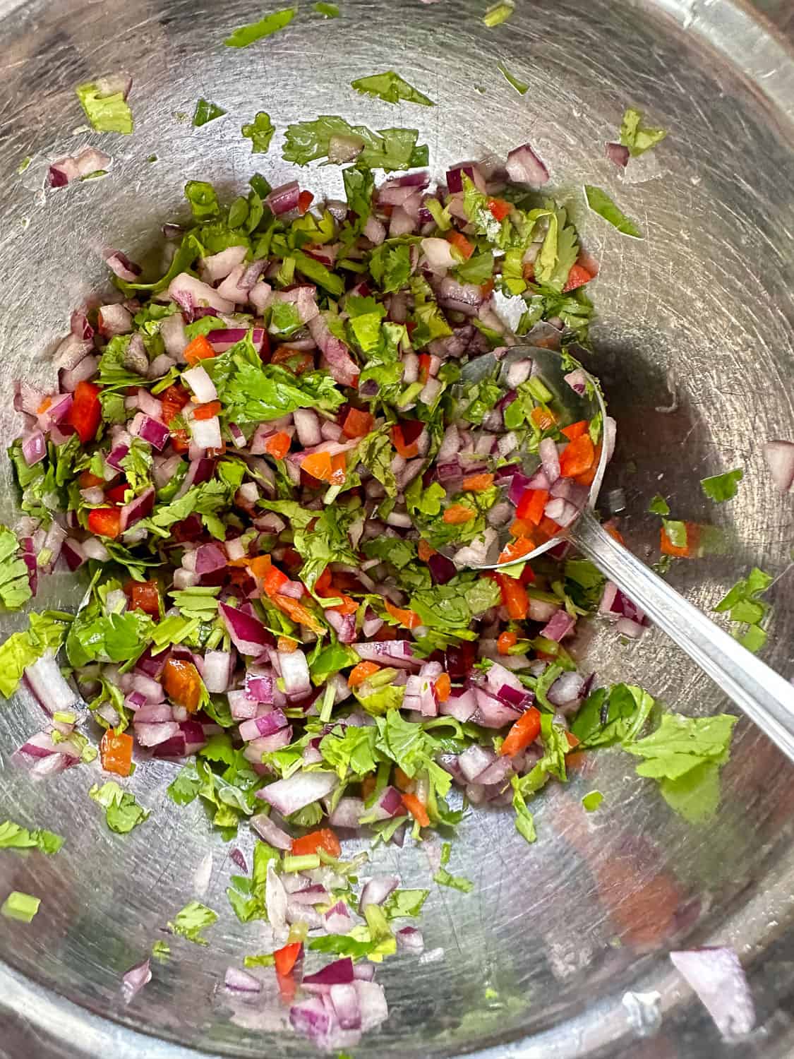 Aromatics for guacamole freshly combined in small bowl