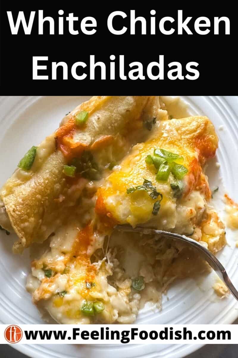 two white chicken enchiladas on white plate with fork