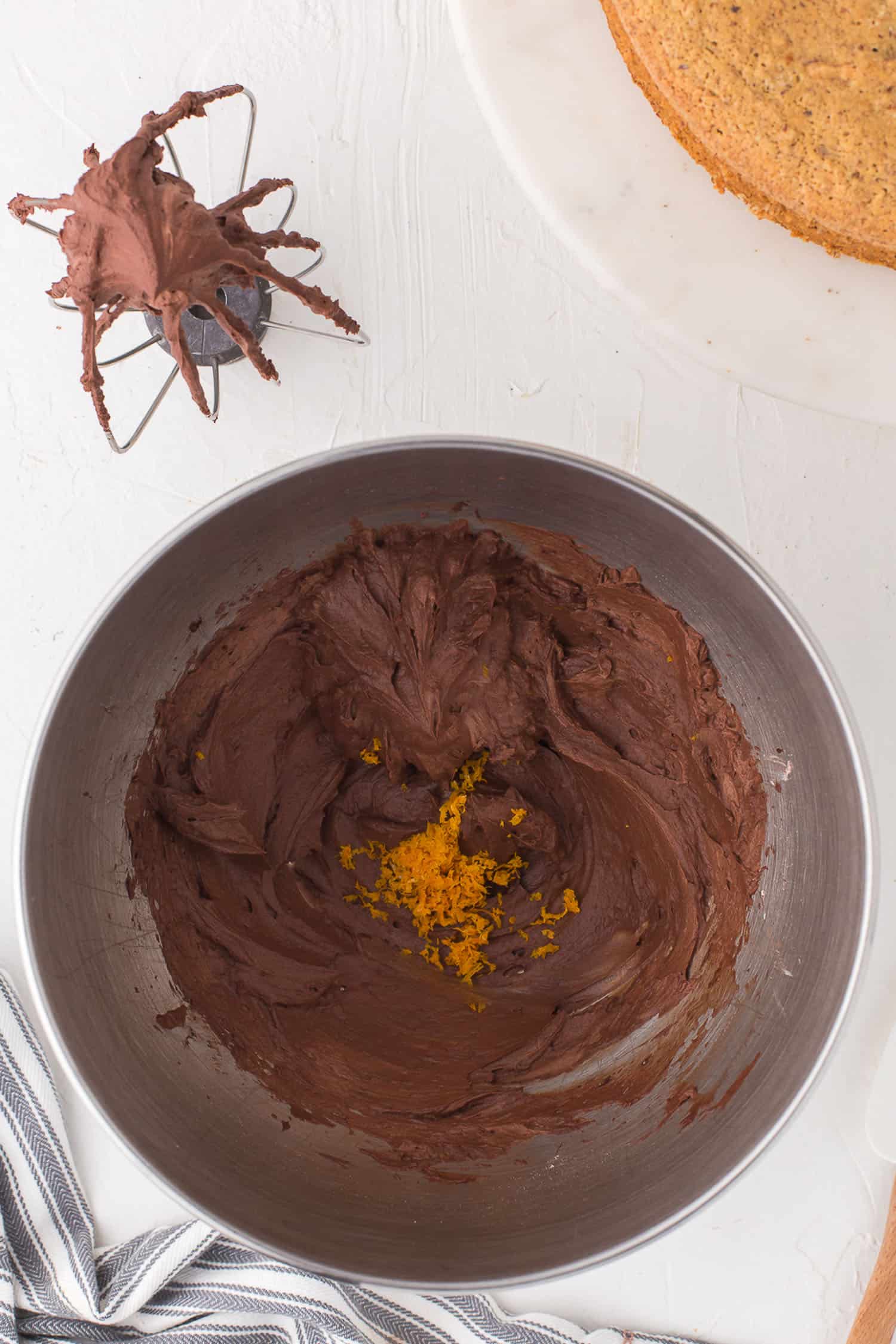 orange zest on chocolate filling in mixing bowl