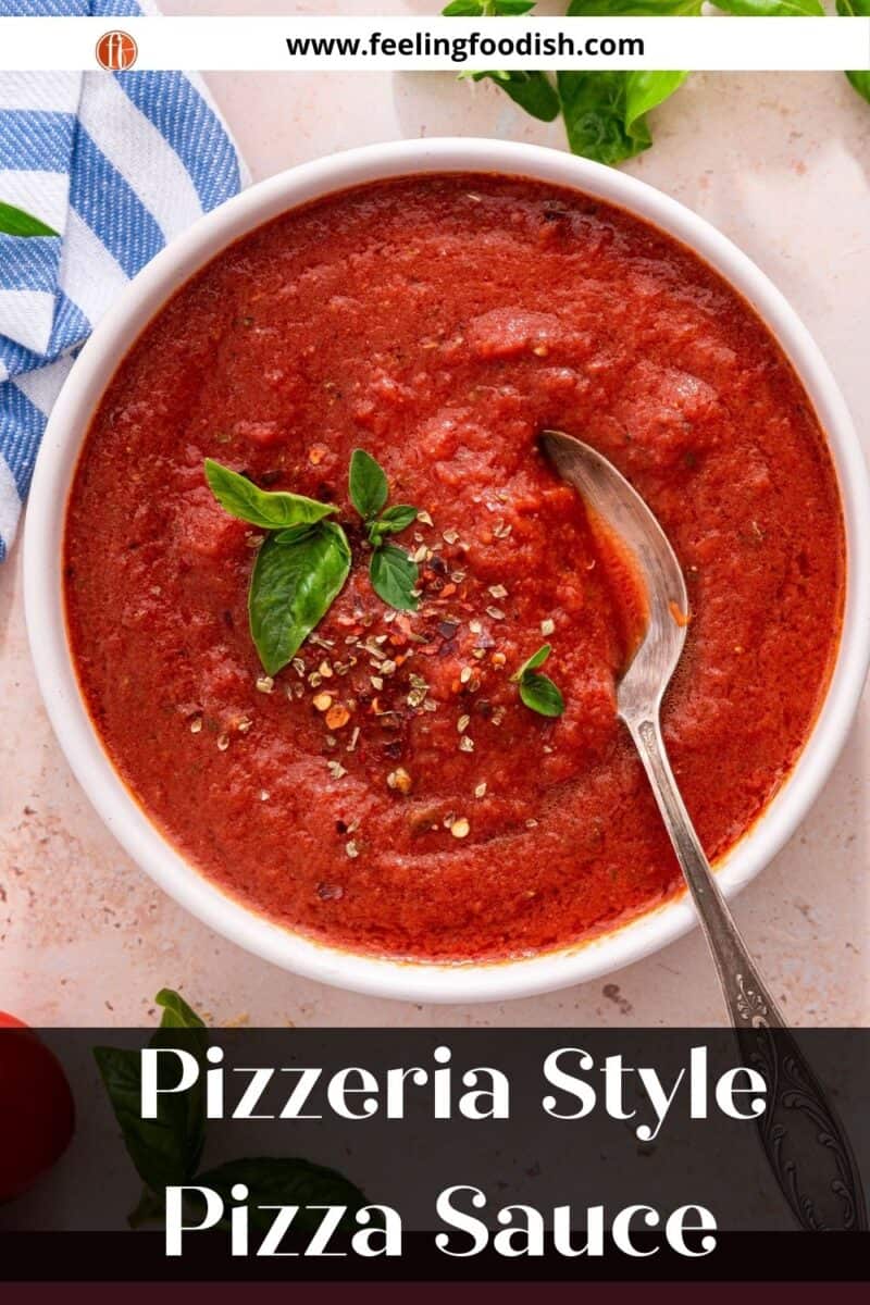 bowl of pizza sauce with basil and spoon