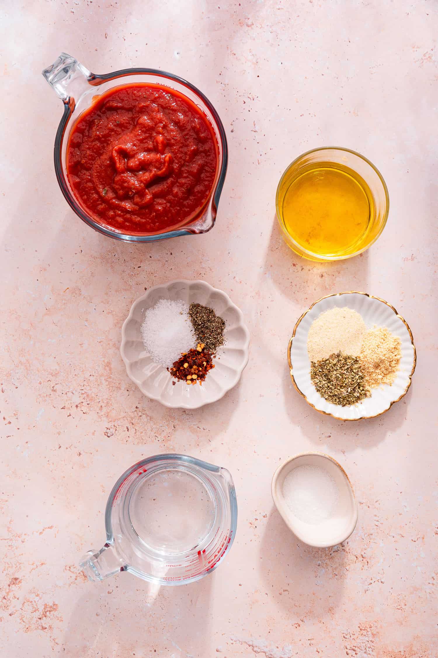pizza sauce ingredients in bowls ready to mix