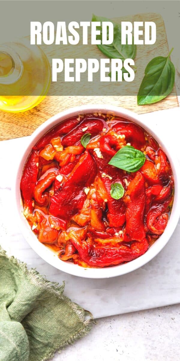 roasted red peppers in white bowl with basil
