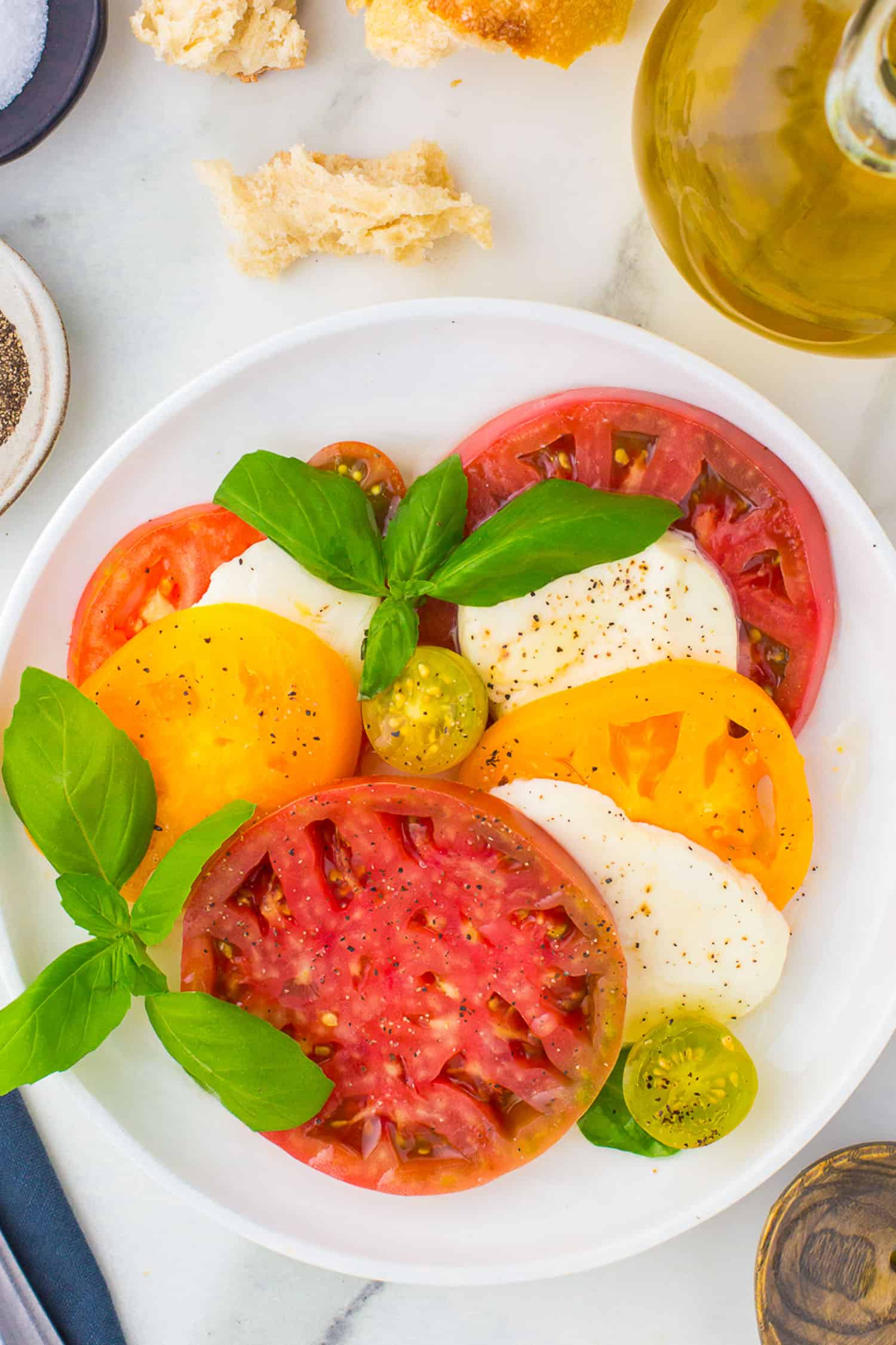 small white plate of caprese salad