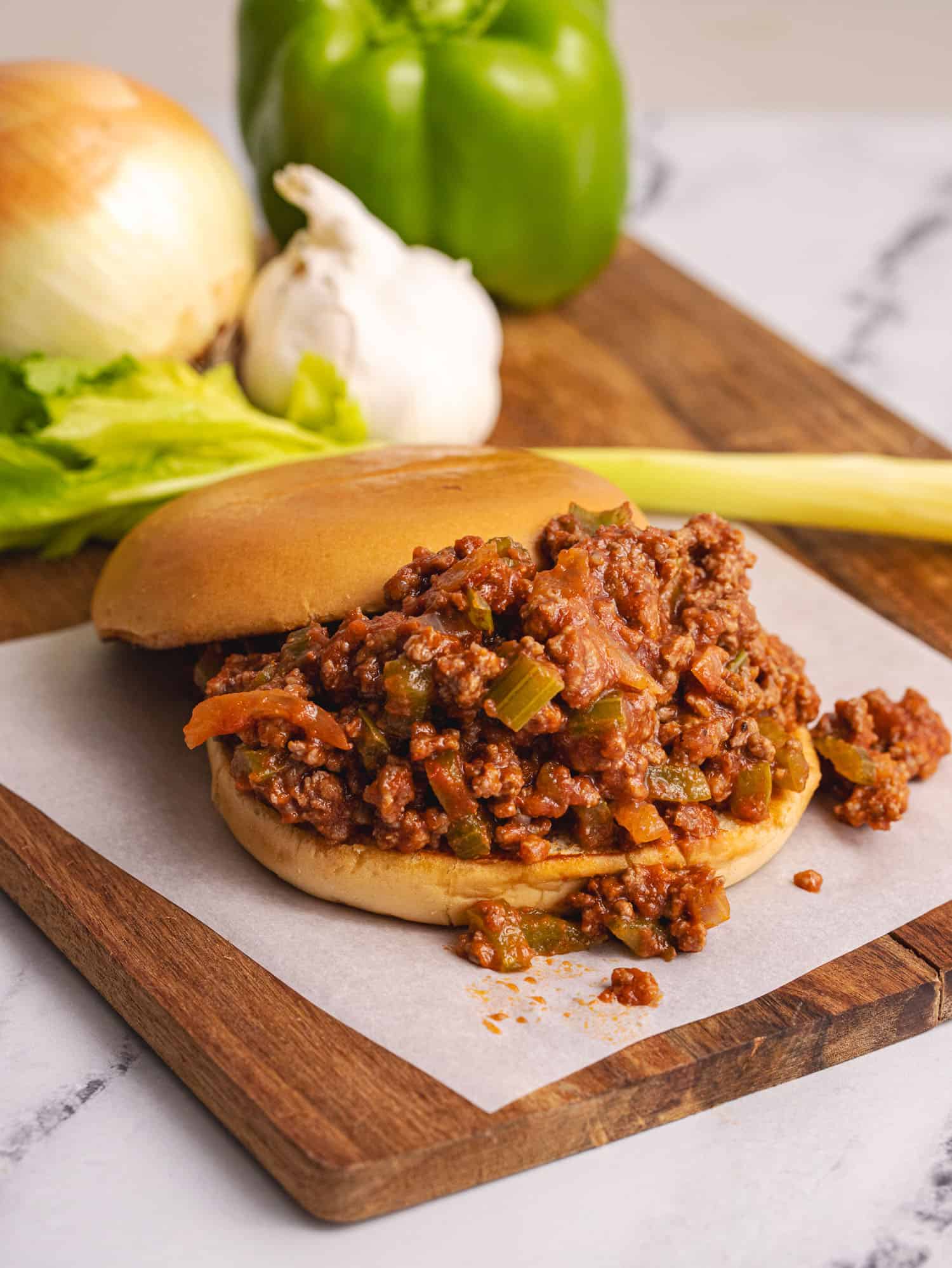 close up on sloppy joe on parchment paper 