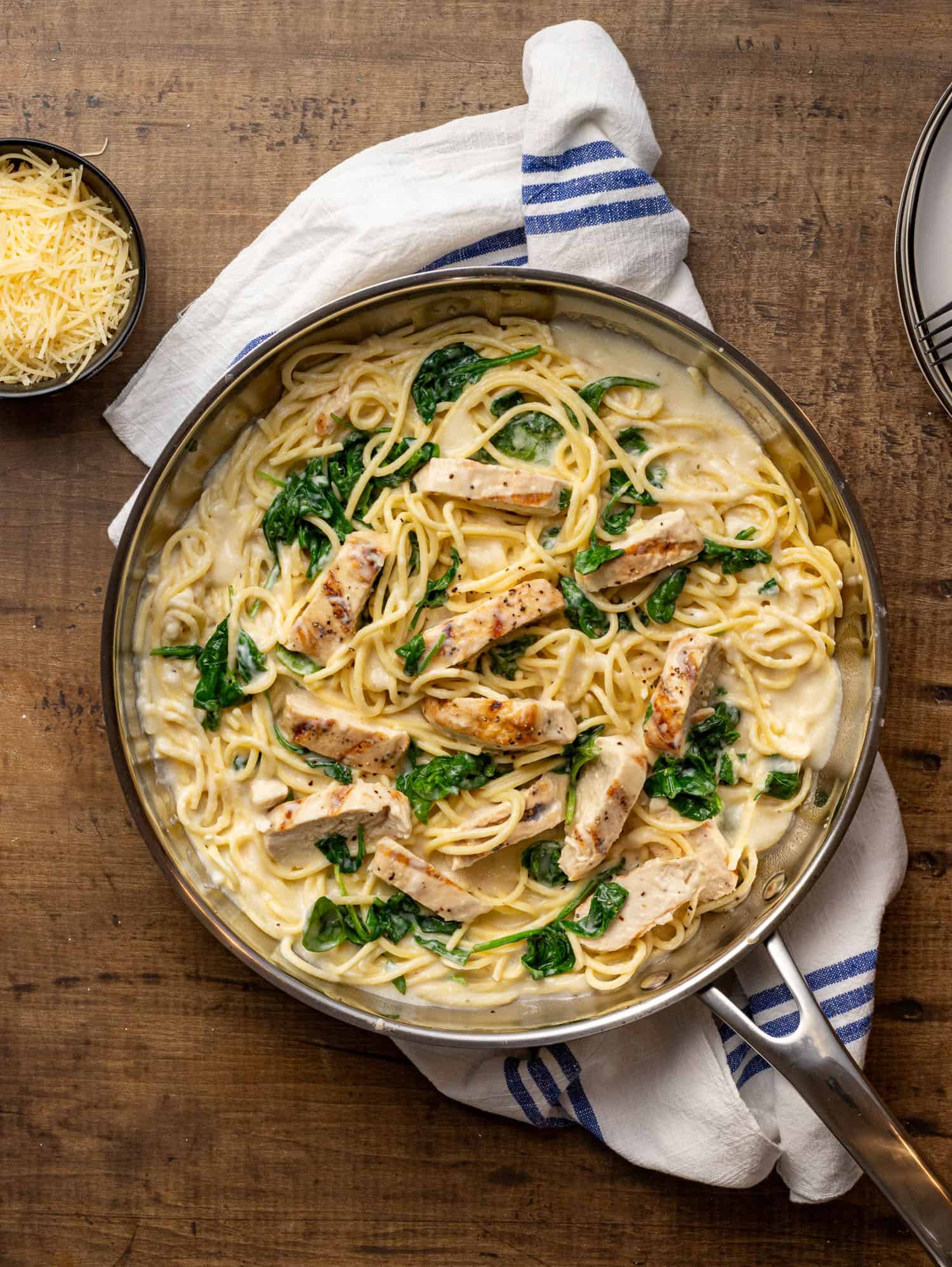 top view of chicken florentine pasta in silver pan