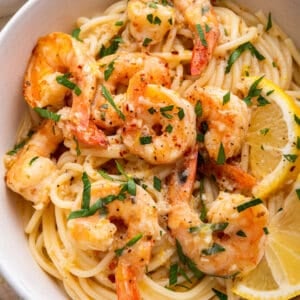 close up view of lemon garlic shrimp pasta with parsley